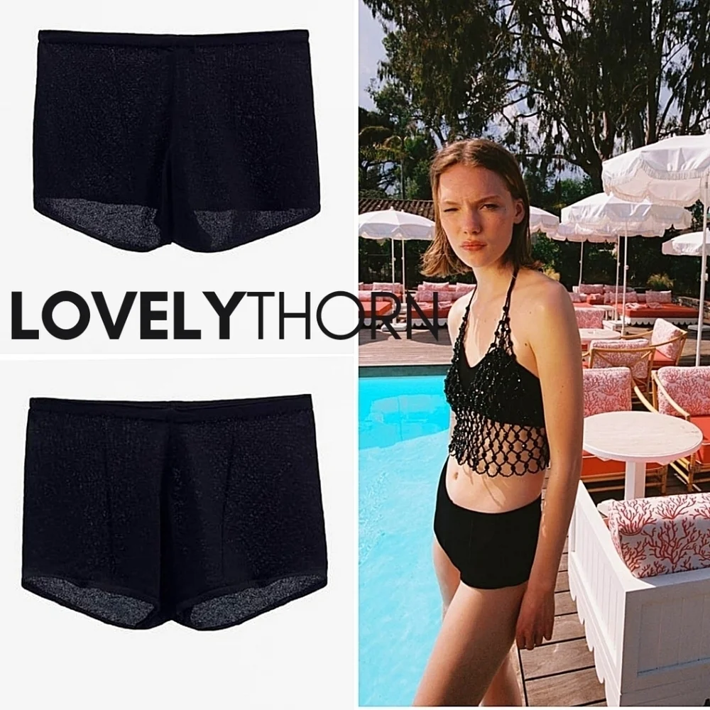 ZARA // black slightly frilled hem high elastic waist knit shorts